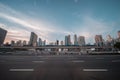 Moving Dubai metro train on the bridge against upscale community skyline. Royalty Free Stock Photo