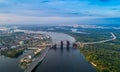 Panoramic view of a modern city with a river, unfinished bridge and park part of the city Royalty Free Stock Photo