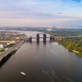 Panoramic view of a modern city with a river, unfinished bridge and park part of the city Royalty Free Stock Photo