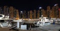 Panoramic view with modern skyscrapers and water pier of Dubai Marina