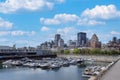 Panoramic view of Montreal modern skyline of downtown financial city center and Old Port of Montreal facing Saint Lawrence River Royalty Free Stock Photo