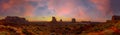 Panoramic view of Monument Valley National Park during an orange sunrise in Utah, United States Royalty Free Stock Photo