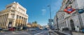 Panoramic view of Motion blurred cars and people at Banco de Espana Central Bank subway station in Alcala street downtown Madrid