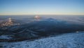 Panoramic view from Mount Beshtau in winter in the evening at sunset and a conical shadow from the mountain on the ground