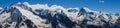 Panoramic view from Mount Mussa-Achitara to the snow-capped Caucasus mountains. Dombai, Karachay-Cherkess Republic, Russia