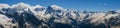 Panoramic view from Mount Mussa-Achitara to the snow-capped Caucasus mountains. Dombai, Karachay-Cherkess Republic, Russia