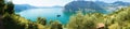 Panoramic view of mountain lake with island in the middle. Panorama from Monte Isola Island with Lake Iseo. Italian landscape. Royalty Free Stock Photo