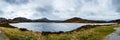 Panoramic view of a snowy mountain peak over the lake - Highlands, Scotland Royalty Free Stock Photo