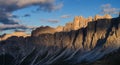 Panoramic view of the mountain peaks during sunset. The Dolomite Alps, Italy. Natural scenery in the highlands. Royalty Free Stock Photo