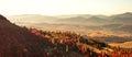 Panoramic view of a mountain range in the Carpathian Mountains during a hazy autumn sunset Royalty Free Stock Photo