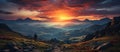 Panoramic view of the mountain range at sunset with a hiker in the foreground Royalty Free Stock Photo