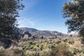 Panoramic view of the mountain on the route of the river Monachil with blue sky and green vegetation, in Los Cahorros, Granada