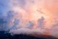 Panoramic view of the mountains in incredible clouds shot in the beautiful sunset light. Drone shot top view. Royalty Free Stock Photo