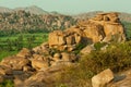 Panoramic view of mountains and large rocks in sunset light in Hampi in Karnataka, India Royalty Free Stock Photo