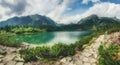 Panoramic view of mountains and  Poprad Lake Popradske pleso in High Tatras National Park. Slovakia. Royalty Free Stock Photo