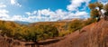 Panoramic view of the mountains of Serrania de Ronda and the chestnut forest in autumn. Trekking route, scenic, around the