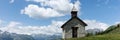 Panoramic view of the mountains. Small chapel on the mountain with a view of the Grossglockner in Austria Royalty Free Stock Photo
