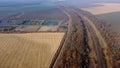 Panoramic Moving Freight Train Along Railway Tracks, Trees Agricultural Fields