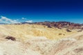 Panoramic view of mudstone and claystone badlands at Zabriskie Point. Death Valley National Park, California USA. Royalty Free Stock Photo