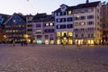 Panoramic view of Munsterhof square with Guild houses at night,