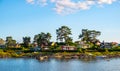 Panoramic view of Nakholmen island on Oslofjord harbor near Oslo, Norway, with summer cabin houses at shoreline in early autumn