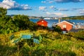 Panoramic view of Nakholmen island on Oslofjord harbor with summer cabin houses at shoreline in early autumn near Oslo, Norway