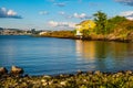 Panoramic view of Nakholmen island on Oslofjord harbor with summer cabin houses at shoreline in early autumn near Oslo, Norway