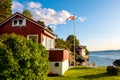 Panoramic view of Nakholmen island on Oslofjord harbor with summer cabin houses at shoreline in early autumn near Oslo, Norway