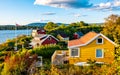 Panoramic view of Nakholmen island on Oslofjord harbor with summer cabin houses at shoreline in early autumn near Oslo, Norway