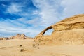 Panoramic view of natural rock bridge and Wadi Rum desert, Jordan Royalty Free Stock Photo