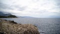 Panoramic view of nice colorful huge cliff and sea. Action. View of the rocks and waves of the sea Royalty Free Stock Photo