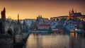 Panoramic view of night time illuminations of Prague Castle, Charles Bridge and St Vitus Cathedral reflected in the Vltava river. Royalty Free Stock Photo