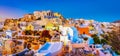 Panoramic view of Oia town, Santorini island, Greece at sunset. Royalty Free Stock Photo