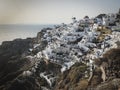 Panoramic view of Oia village with traditional white architecture and windmills in Santorini island in Aegean sea, travel Royalty Free Stock Photo