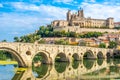 Panoramic view at the Old Bridge over Orb river with Cathedral of Saint Nazaire in Beziers - France Royalty Free Stock Photo