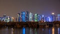 A panoramic view of the old dhow harbour night timelapse in Doha, Qatar, with the West Bay skyline in the background. Royalty Free Stock Photo