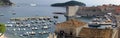 Panoramic view of the old port and marina, from the town\'s wall, on the Adriatic Sea background, Dubrovnik, Croatia Royalty Free Stock Photo