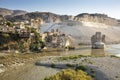 Panoramic view of the Old Tigris Bridge, Castle and minaret in the city of Hasankeyf, Turkey. Royalty Free Stock Photo