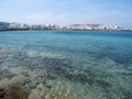 Panoramic view of Old Town Chora of Mykonos with tourists and sea