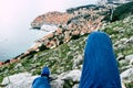 Panoramic view of Old town of Dubrovnik from hill, Croatia Male Legs on a rock in a viewpoint Royalty Free Stock Photo