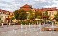 Panoramic view of Olkusz market square with waterworks and historic tenement houses in Beskidy mountain region of Lesser Poland