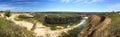 Panoramic view of opencast mining quarry, industrial landscape, limestone mining