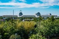 Panoramic view of Orlando Convention Center and green forest background on lightblue sky cloudy background2 Royalty Free Stock Photo