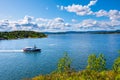 Panoramic view of Oslofjord harbor from rocky recreational cape of Hovedoya island near Oslo, Norway, with Gressholmen island in