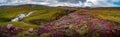 Panoramic view over beautiful colorful Icelandic landscape with Faxi waterfall, ancient moss and lichen, tundra flowers and meadow Royalty Free Stock Photo