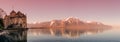 Panoramic view over bloody sunset at Swiss Alpes mountains, Leman lake and old castle, Switzerland