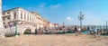 Panoramic view over busy with tourists crowds Venice, piers, promenade embankment near Doge Palace and Campanile in Venice