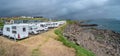 Panoramic view over city camping site in Torshavn, Faroe Islands, at the oceanic shore with many campers and vacationers arriving