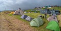 Panoramic view over city camping site in Torshavn, Faroe Islands, at the oceanic shore with many tents and vacationers arriving