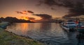 Panoramic view over cruise tour ships, boats and catamarans docked at Ushuaia harbor in Tierra del Fuego National Park at Royalty Free Stock Photo